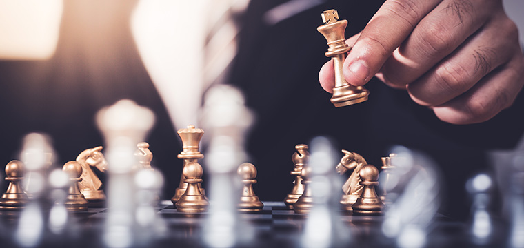 What challenges might arise during a business feasibility study in Qatar, and how can they be mitigated?